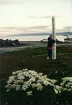 Chelsea hugs the 'MayPeace Prevail On Earth' sign.
