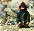 Chelsea and a Gentoo penguin exchange glances.
